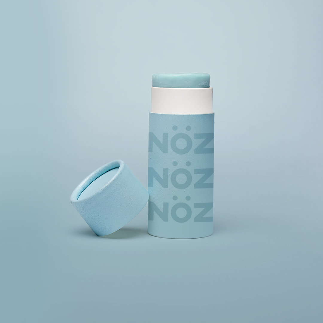 blue NOZ sunscreen with cap off