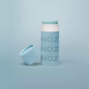 blue NOZ sunscreen with cap off